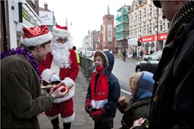 Santa and his Elves capture this child's imagination in London